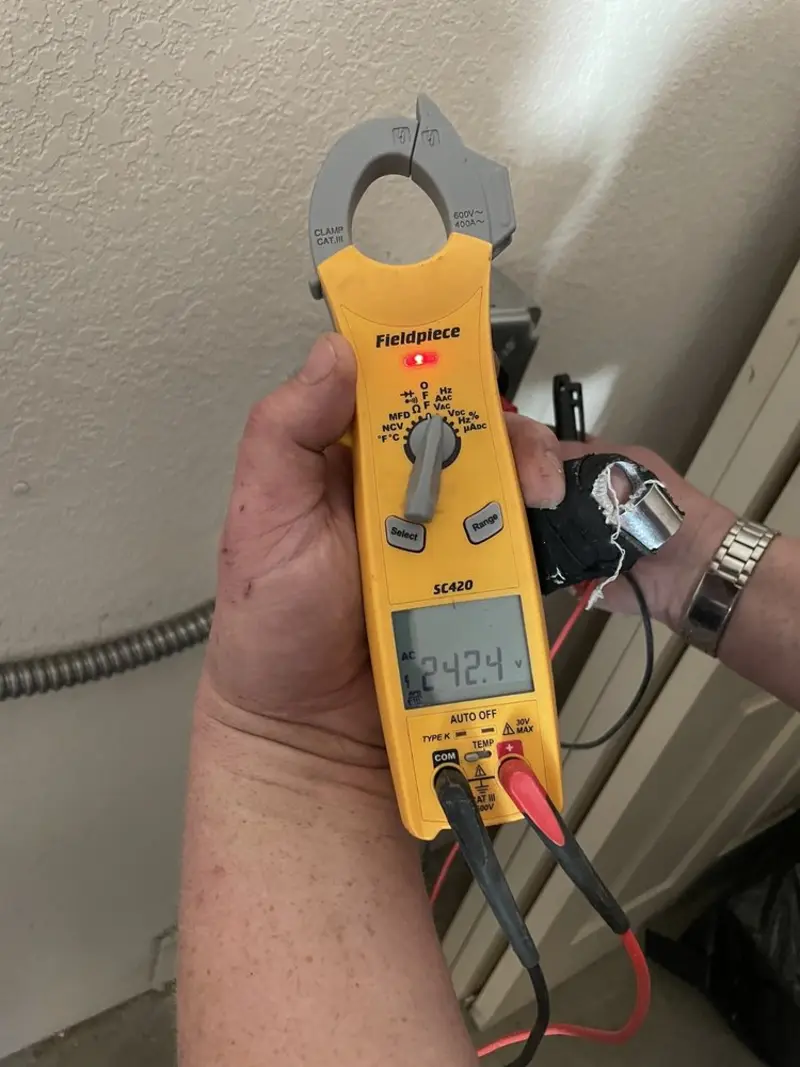 Voltage testing with clamp meter during Generator Installation in Burlington
